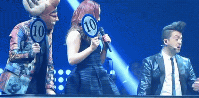 Woman Singing Into Microphone With Sign 10 GIF