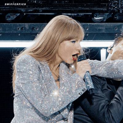 Woman Singing Into Microphone With Swifter Pics GIF