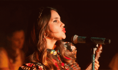 Woman Singing Into Microphone With Tongue Out GIF