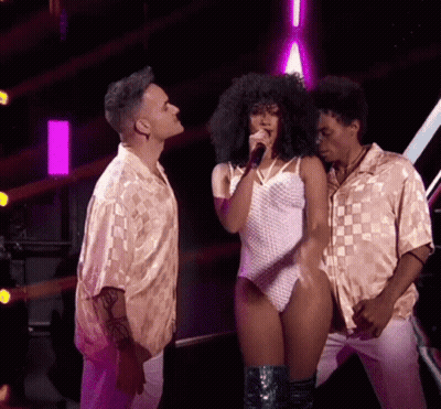 Woman Singing Into Microphone With Two Men Watching GIF