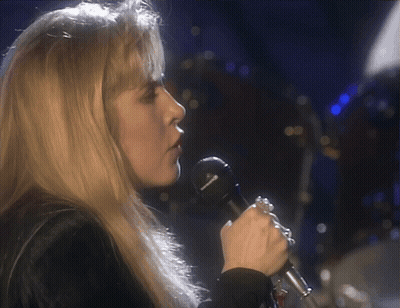 Woman Singing Into Sennheiser Microphone On Stage GIF