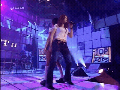 Woman Singing On Stage Top Of The Pops GIF