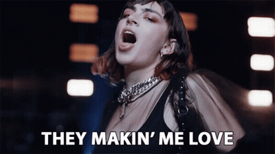 Woman Singing They Makin' Me Love In Dark Room GIF