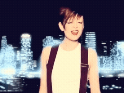 Woman Singing With City Skyline GIF