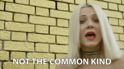 Woman Singing Yellow Brick Wall Saying Not Common Kind GIF