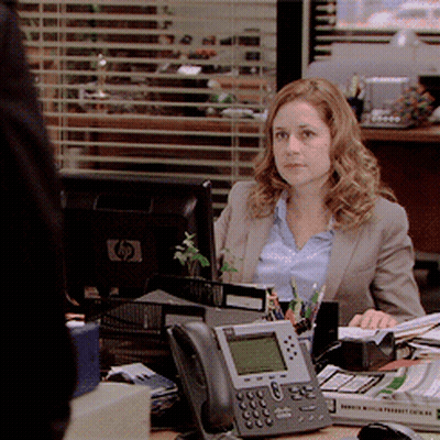 Woman Sitting At Desk In Front Of HP Monitor GIF