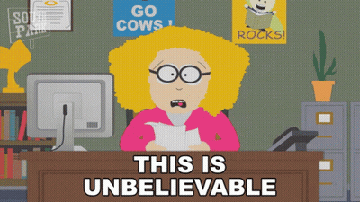 Woman Sitting At Desk Saying Unbelievable GIF