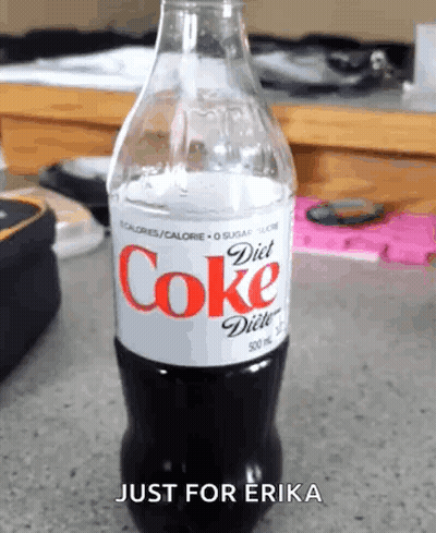 Woman Sitting At Desk With Coke GIF