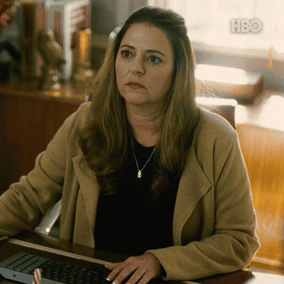 Woman Sitting At Desk With HBO Logo GIF