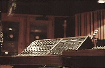 Woman Sitting At Desk With Instruments GIF