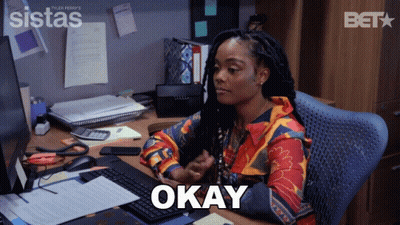 Woman Sitting At Desk With Okay Screen GIF