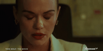 Woman Sitting At Desk With Paramount Logo GIF