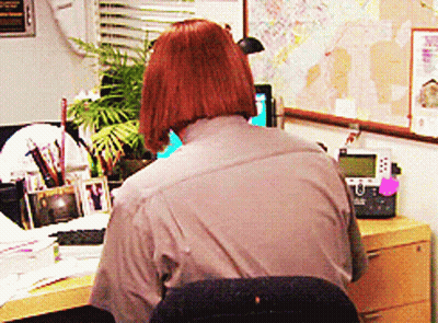 Woman Sitting At Desk With Telephone And Map GIF