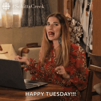 Woman Sitting At Laptop Saying Happy Tuesday GIF