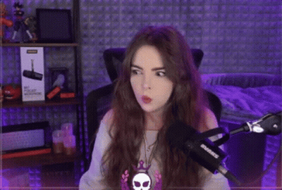 Woman Sitting At Microphone In Purple Lights GIF