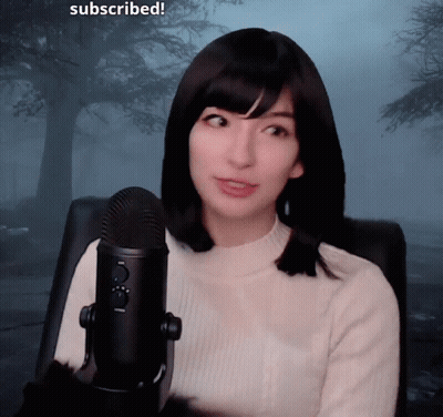 Woman Sitting At Microphone Saying Subscribed GIF