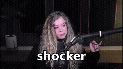 Woman Sitting At Microphone With Shocker On Screen GIF