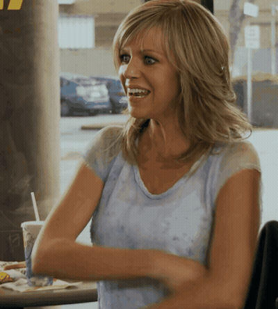 Woman Sitting At Table Arms Crossed Smiling GIF