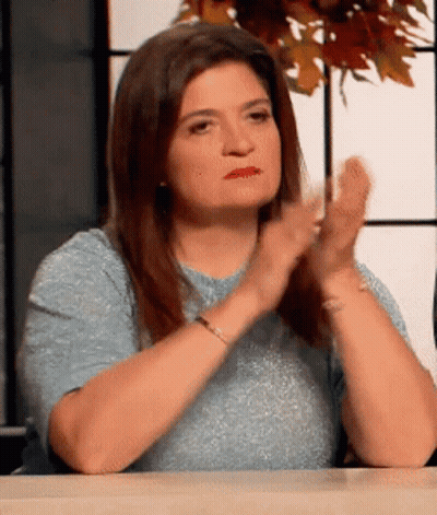 Woman Sitting At Table Clapping GIF