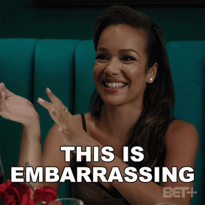 Woman Sitting At Table Embarrassed GIF