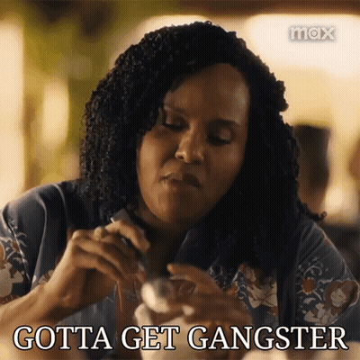 Woman Sitting At Table Gotta Get Gangster GIF