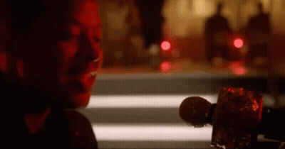 Woman Sitting At Table Holding Microphone GIF