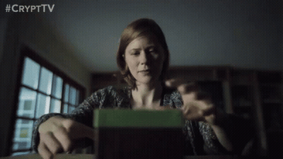 Woman Sitting At Table Looking At Green Box #Crypttv GIF