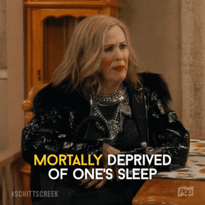 Woman Sitting At Table Mortally Deprived Of One's Sleep GIF
