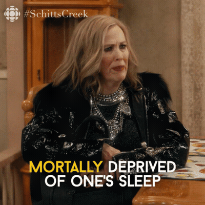 Woman Sitting At Table Mortally Deprived Of One's Sleep GIF