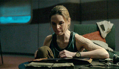 Woman Sitting At Table Reading Book GIF