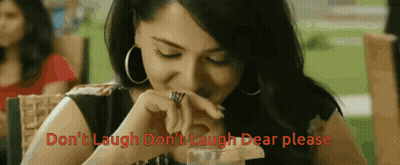 Woman Sitting At Table Saying Don't Laugh Don't Laugh GIF