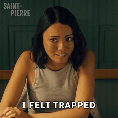 Woman Sitting At Table Saying I Felt Trapped GIF