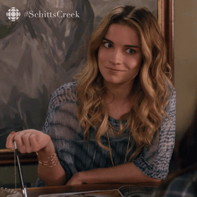 Woman Sitting At Table Saying I Know GIF