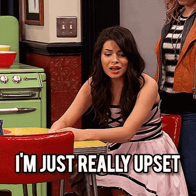Woman Sitting At Table Saying I'm Really Upset GIF