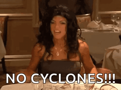 Woman Sitting At Table Saying No Cyclones GIF