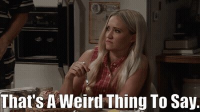 Woman Sitting At Table Saying That's A Weird Thing To Say GIF