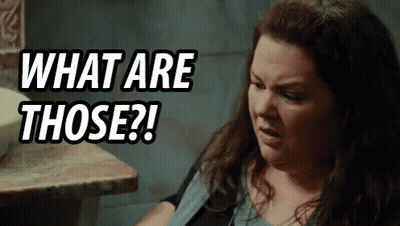 Woman Sitting At Table Saying What Are Those GIF