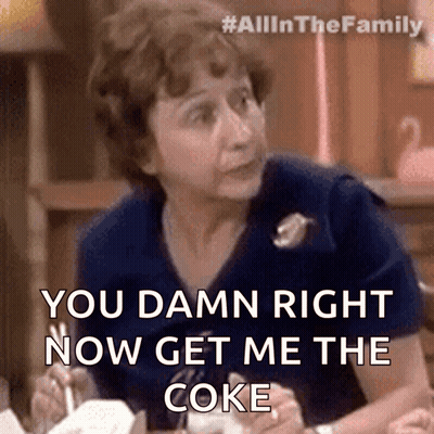 Woman Sitting at Table Says You Damn Right Now Get Me the Coke