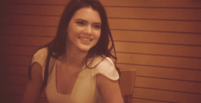 Woman Sitting At Table Smiling GIF