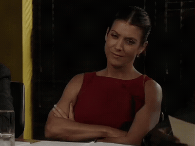 Woman Sitting At Table With Arms Crossed GIF