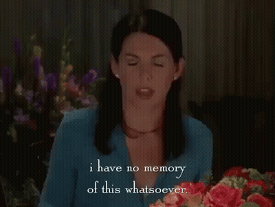 Woman Sitting At Table With Bouquet Talking GIF