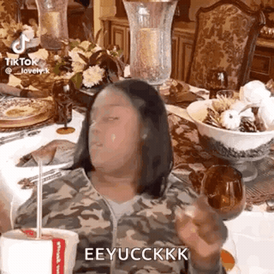 Woman Sitting At Table With Coffee GIF