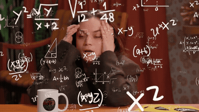 Woman Sitting At Table With Emm Mug GIF