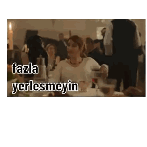 Woman Sitting At Table With Fazla Yerlesmeyin Sticker