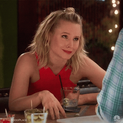 Woman Sitting At Table With Glass Of Water GIF