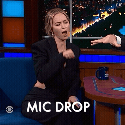 Woman Sitting At Table With Mic Drop GIF