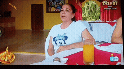 Woman Sitting At Table With Orange Juice GIF