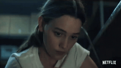Woman Sitting At Table With Pencil GIF