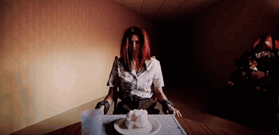 Woman Sitting At Table With Plate Of Food GIF