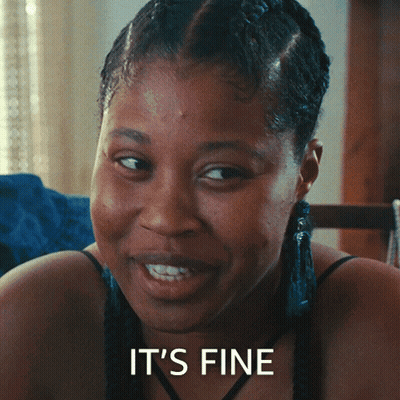 Woman Sitting At Table With Plate, Saying It's Delicious GIF